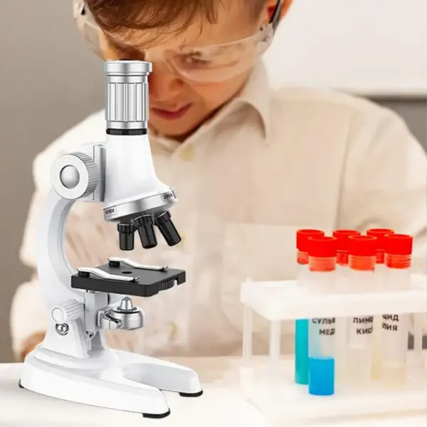 Beginner microscope kit for kids - 100X-1200X magnification with LED light for science experiments.